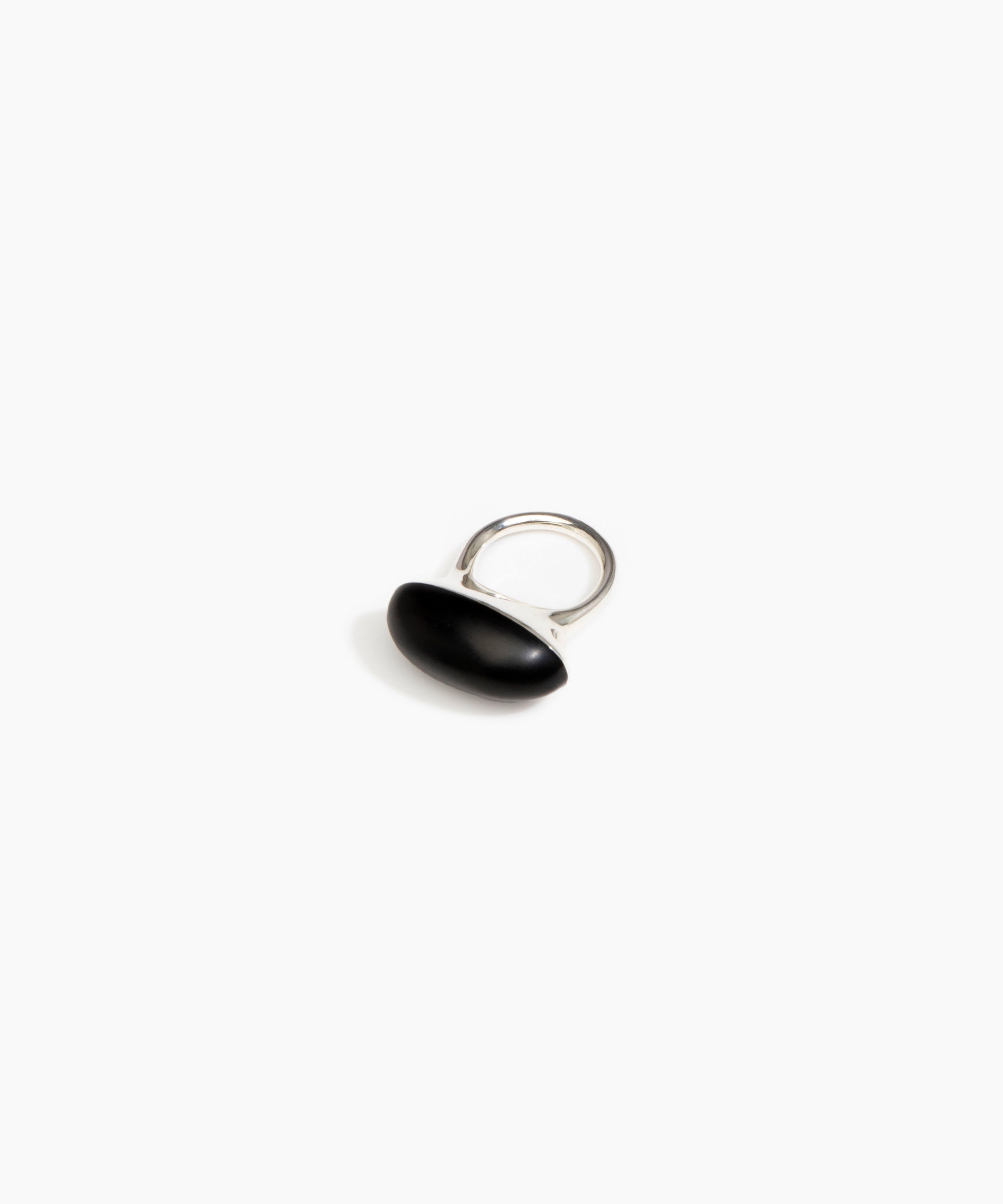 Black ring with a unique design on a white background