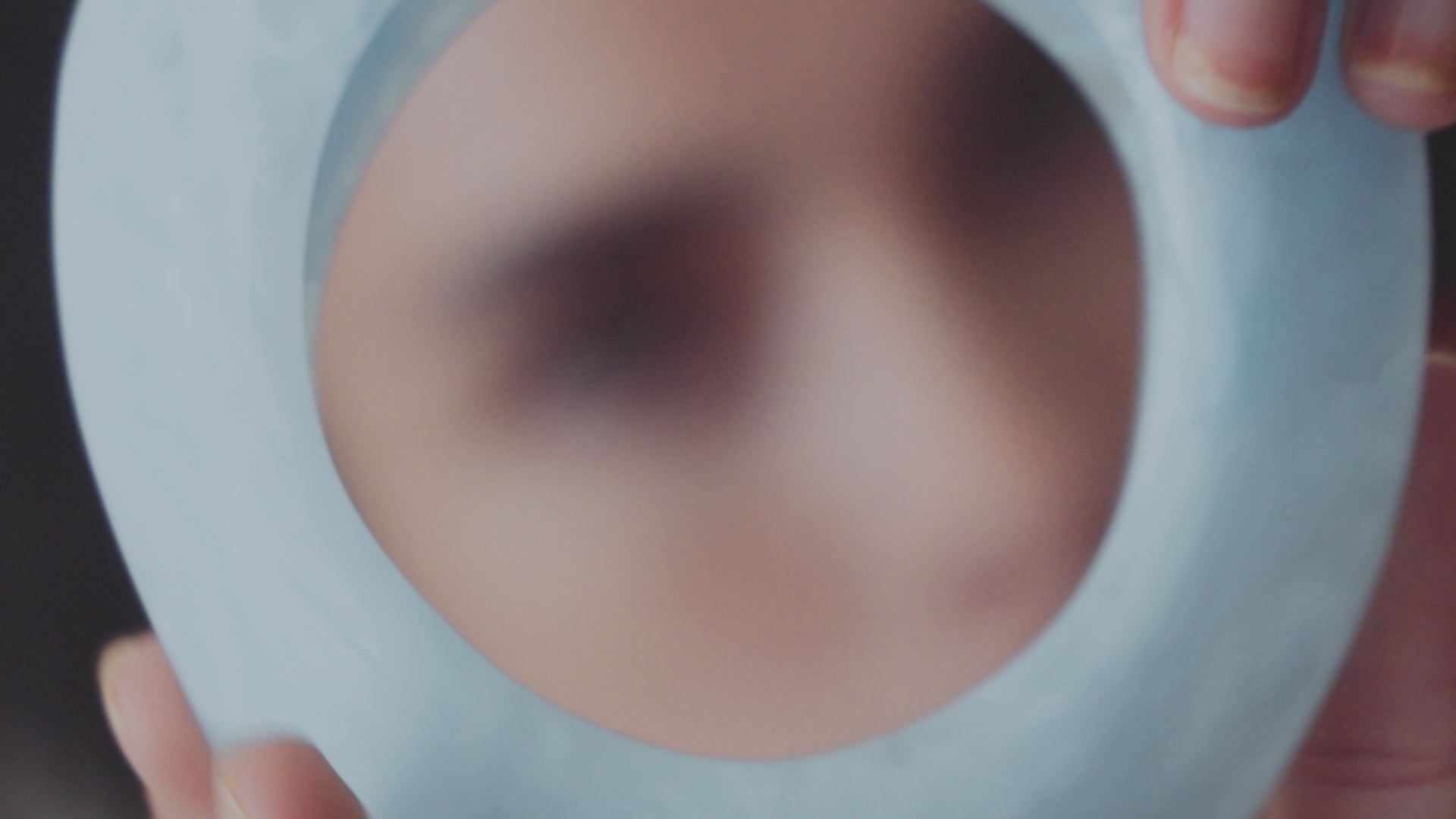 Model with variety of resin jewellery and homewares in studio